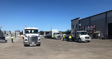delivery trucks in lumber yard
